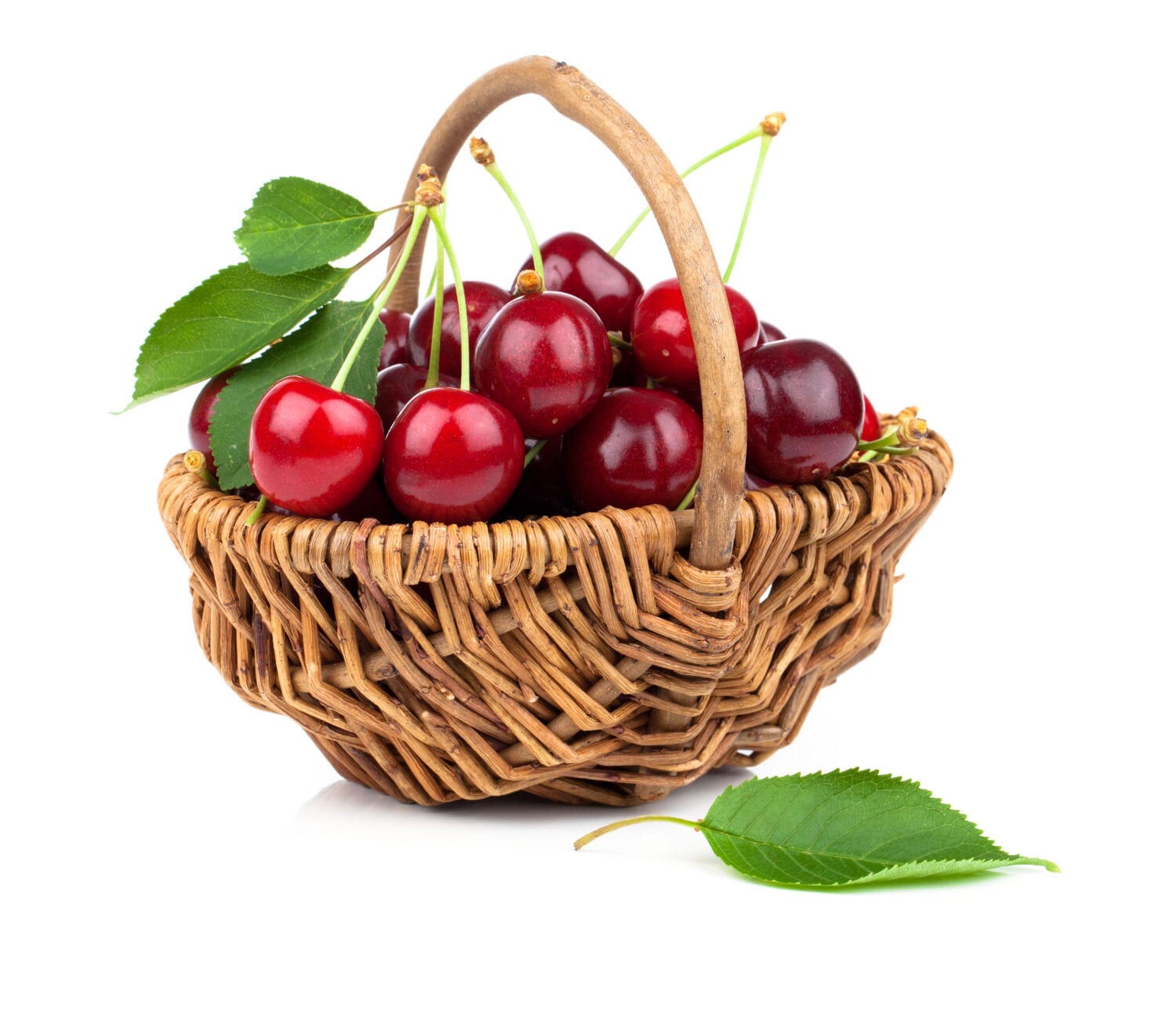 Basket full of fresh red cherry on a white background